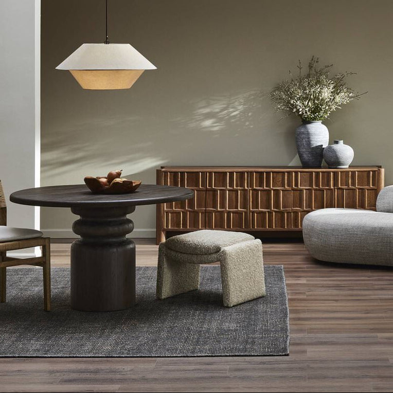 Four Hands Daniel Ottoman in Ivan Sand in a dining room at Addison West