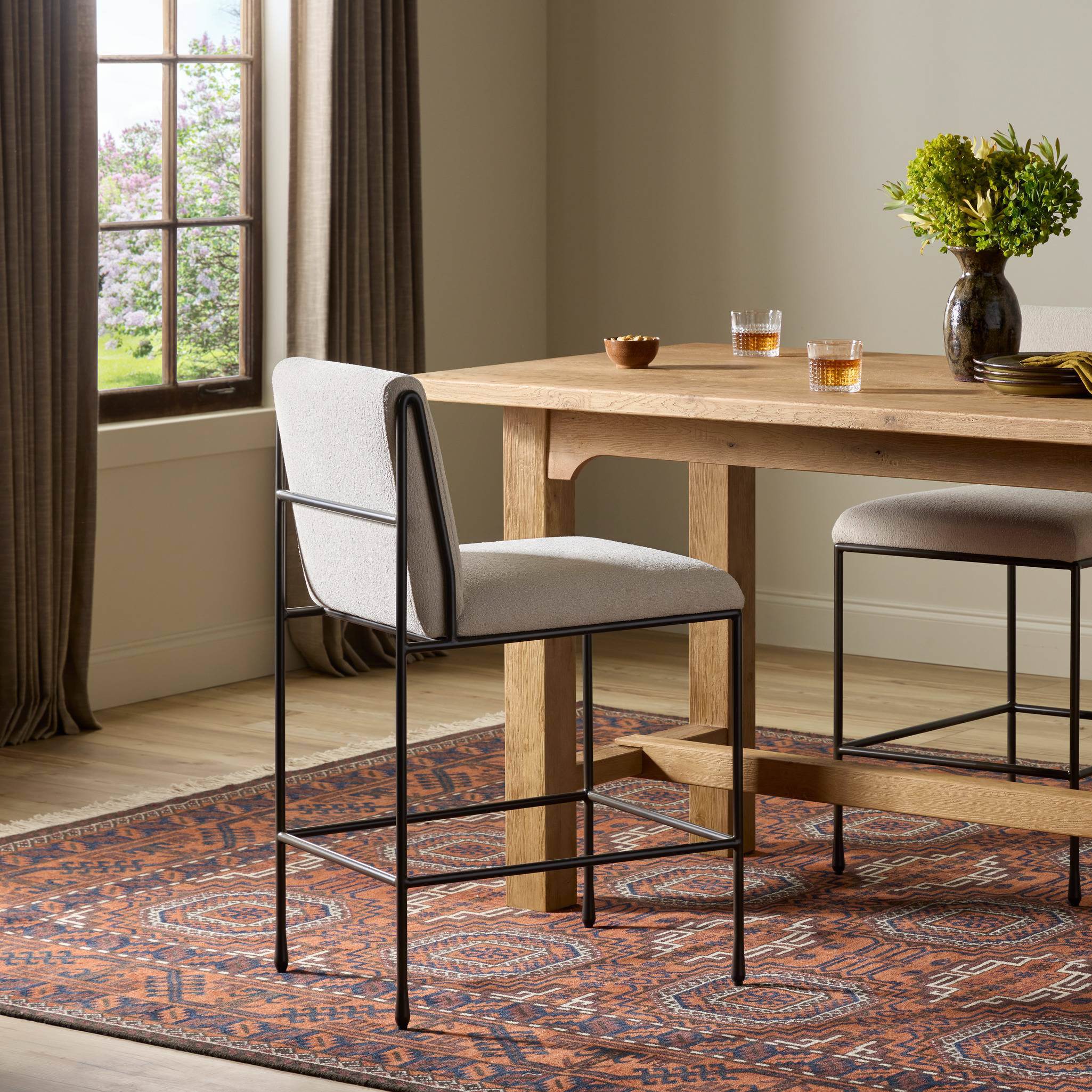 Four Hands Decker Counter Stool in Crypton Wayfarer Snow in dining room at Addison West.