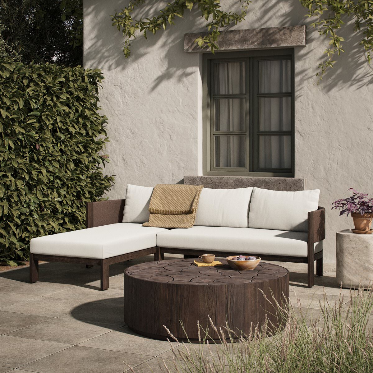 Four Hands Delancy Outdoor 2-Piece Sectional with Left Chaise in Arashi Salt on a patio at Addison West