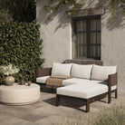 Four Hands Delancy Outdoor 2-Piece Sectional with Right Chaise in Arashi Salt on a patio at Addison West