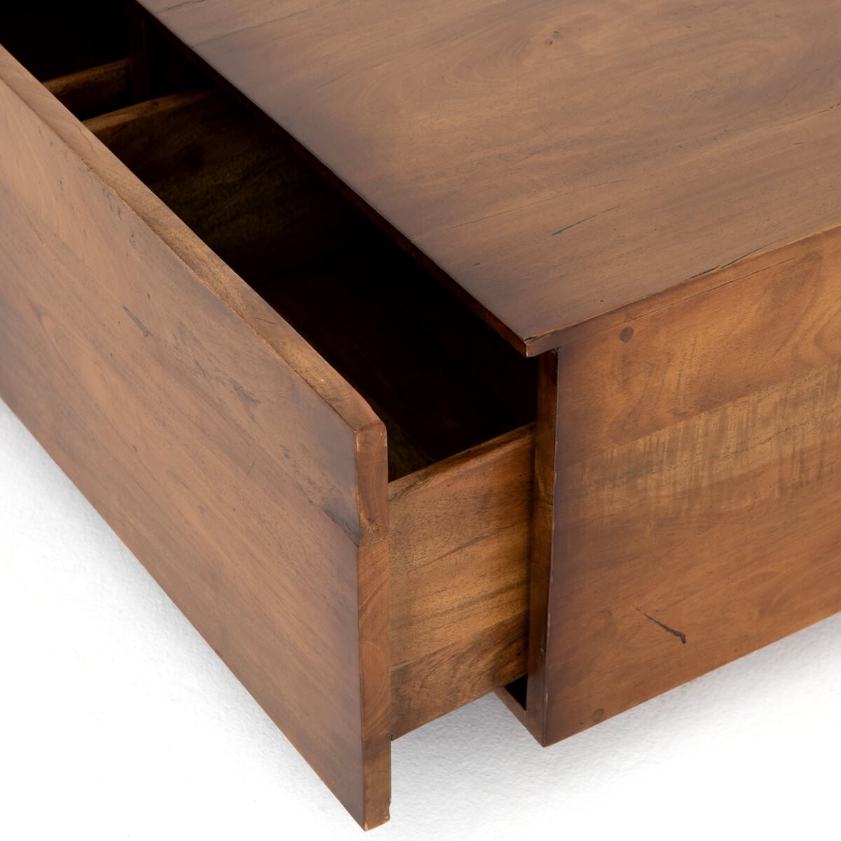 Close up of Four Hands Duncan Storage Coffee Table in Reclaimed Fruitwood on a white background