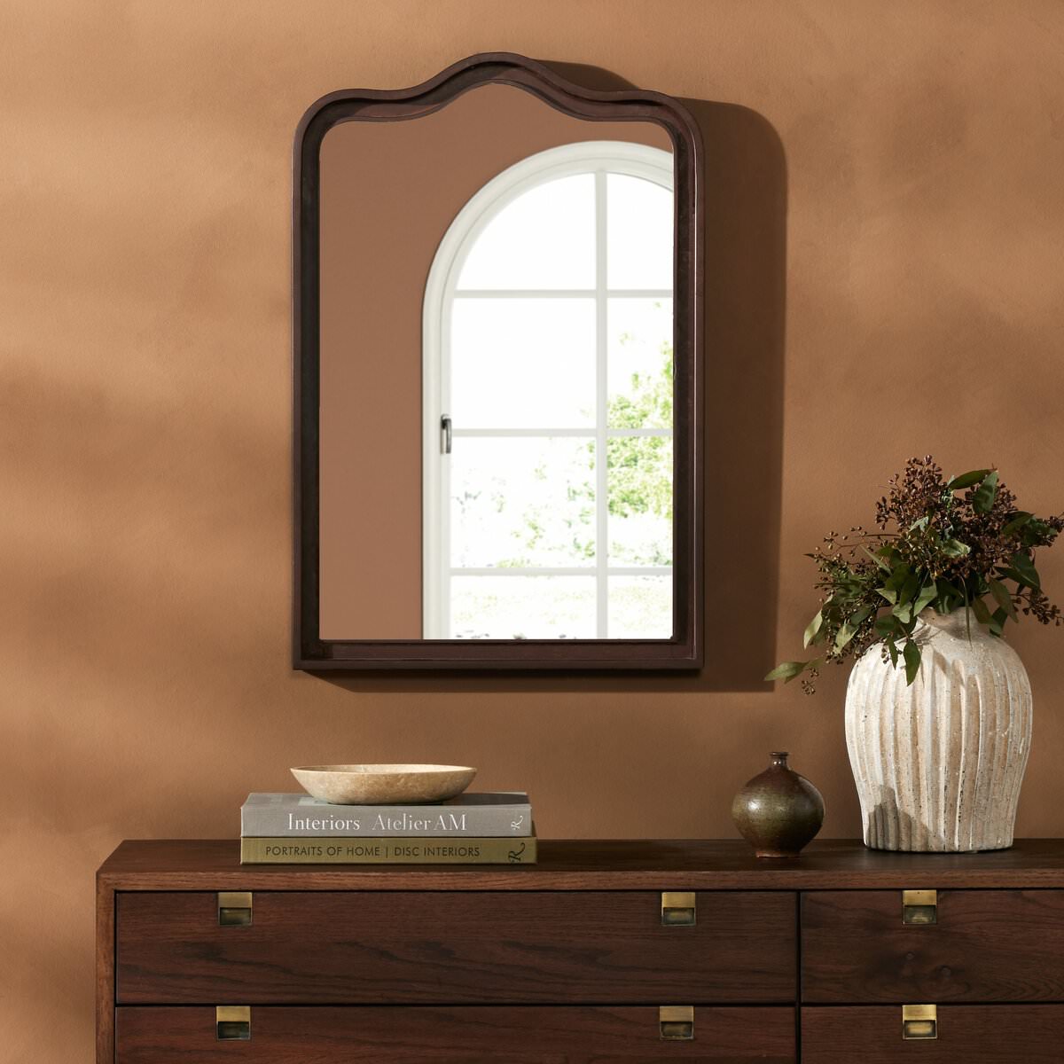 Four Hands Effie Mirror in Rustic Iron in a living room at Addison West