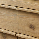 Close up of Four Hands Emmer 6 Drawer Dresser in Aged Smoked Oak Veneer on a white background at Addison West