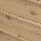 Close up of Four Hands Emmer 6 Drawer Dresser in Aged Smoked Oak Veneer on a white background at Addison West