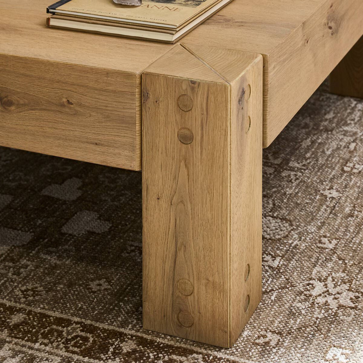 Close up of Four Hands Emmer Coffee Table in Aged Smoked Oak in a living room at Addison West