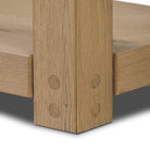 Close up of Four Hands Emmer Console Table in Aged Smoked Oak on a white background at Addison West