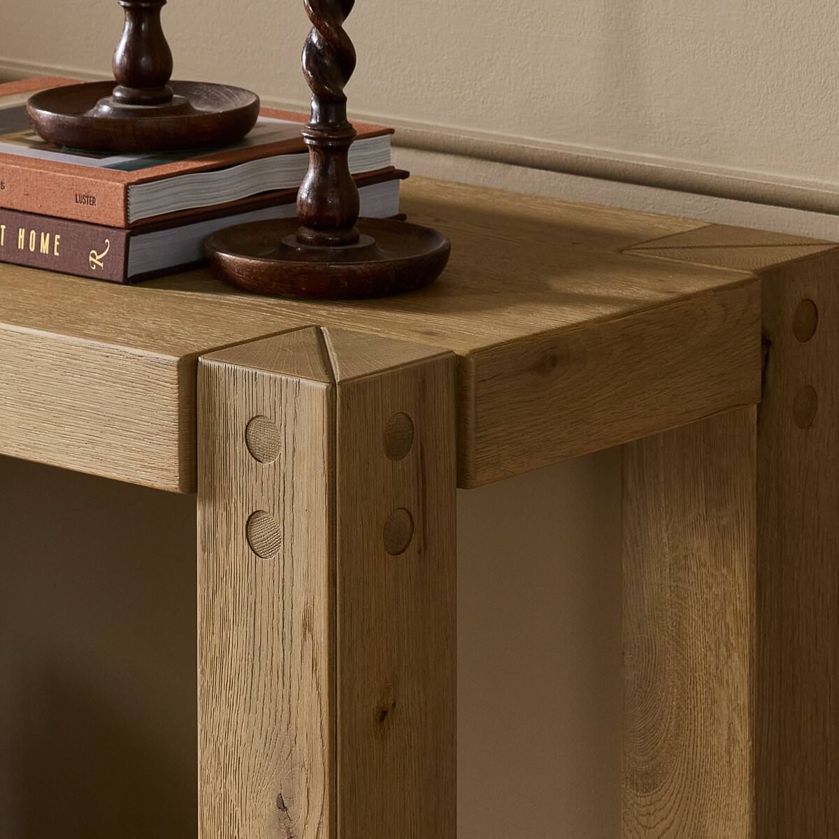 Close up of Four Hands Emmer Console Table in Aged Smoked Oak in a living room at Addison West