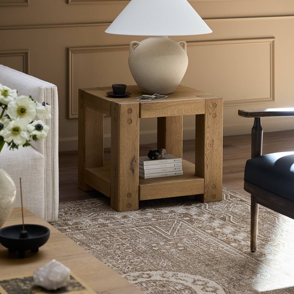 Four Hands Emmer End Table in Aged Smoked Oak in a living room at Addison West