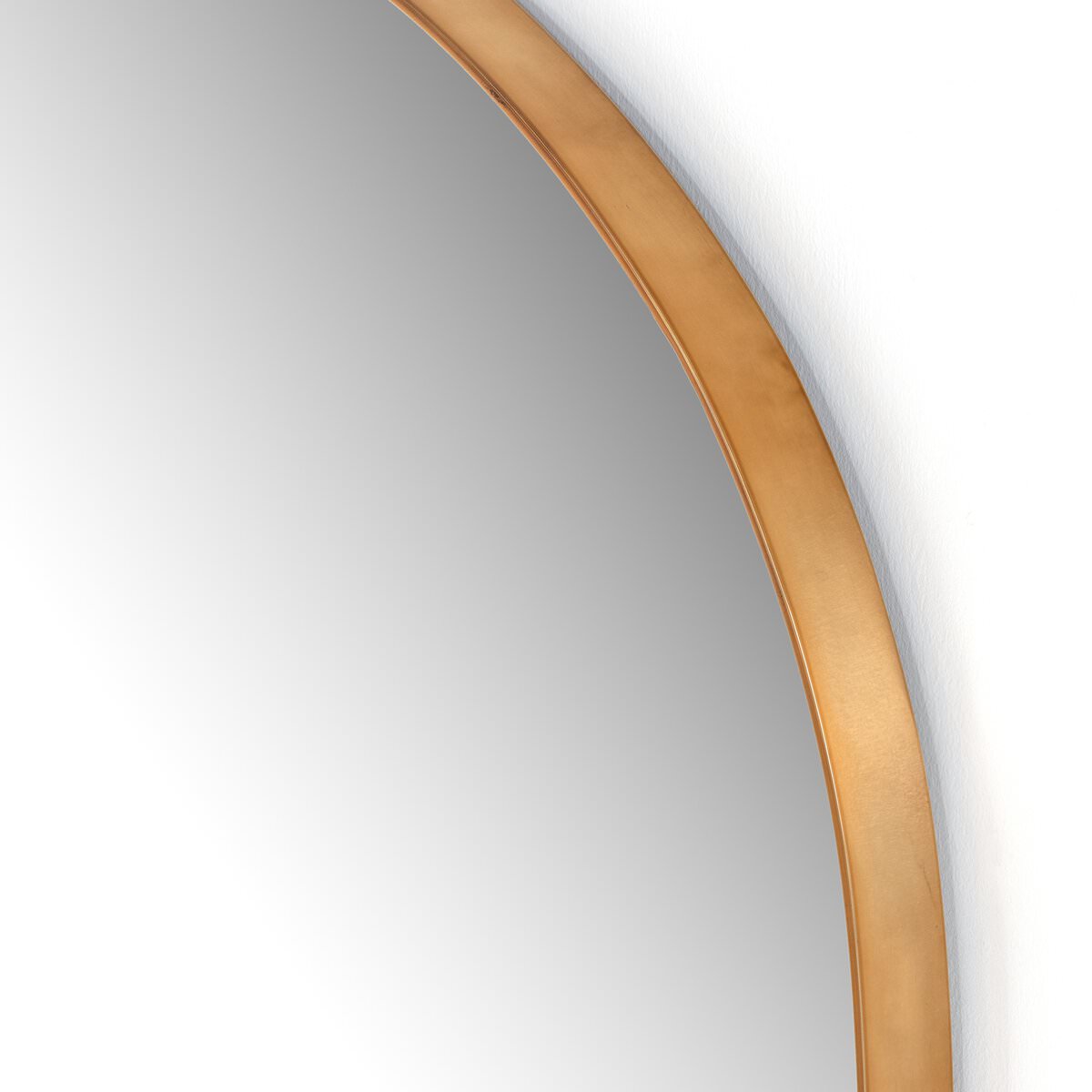 Close up of Four Hands Georgina Wide Mirror in Polished Brass on a white background at Addison West