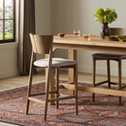 Four Hands Grady Counter Stool in Alcala Taupe in a dining room at Addison West