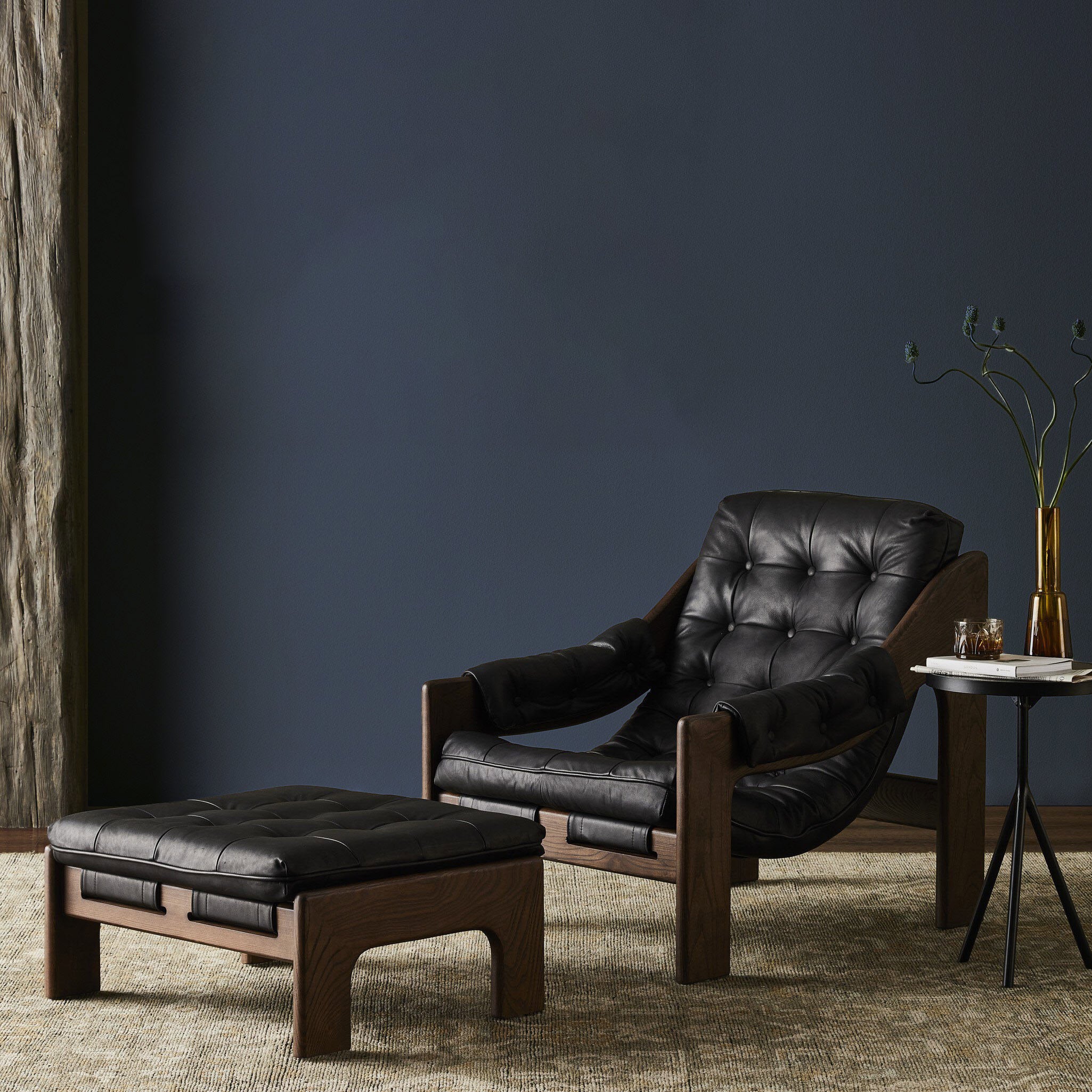 Four Hands Halston Chair & Ottoman in Heirloom Black in a living room at Addison West