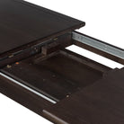 Close up of Four Hands Harper Oval Extension Dining Table 84-104" in Black Mango Veneer on a white background at Addison West