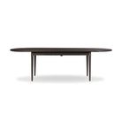 Four Hands Harper Oval Extension Dining Table 84-104" in Black Mango Veneer on a white background at Addison West