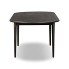 Four Hands Harper Oval Extension Dining Table 84-104" in Black Mango Veneer on a white background at Addison West