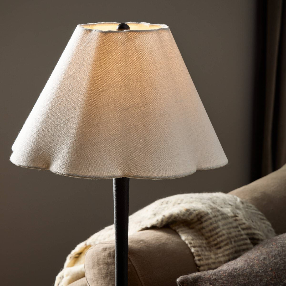 Close up of Four Hands Isabeau Floor Lamp in Black Wrought Iron in a living room at Addison West