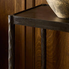 Four Hands Jade Console Table Textured Bronze in dining room at Addison West.