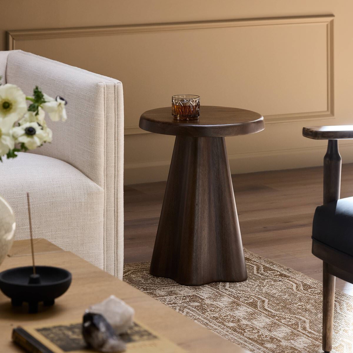 Four Hands Jinx End Table in Tawny Mango in a living room at Addison West