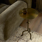 Four Hands Jocelyn End Table in Dark Brass in living room at Addison West.