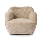 Four Hands Julius Swivel Chair in Beige Shearling on a white background at Addison West