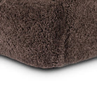 Close up of Four Hands Julius Swivel Chair in Cocoa Shearling on a white background at Addison West