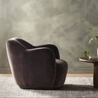 Four Hands Julius Swivel Chair in Surrey Cocoa in a living room at Addison West
