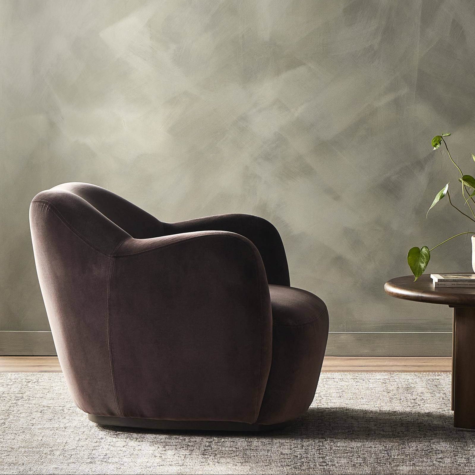 Four Hands Julius Swivel Chair in Surrey Cocoa in a living room at Addison West