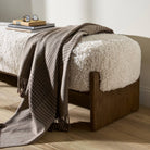 Close up of Four Hands Kirby Accent Bench in Andes Natural in a living room at Addison West