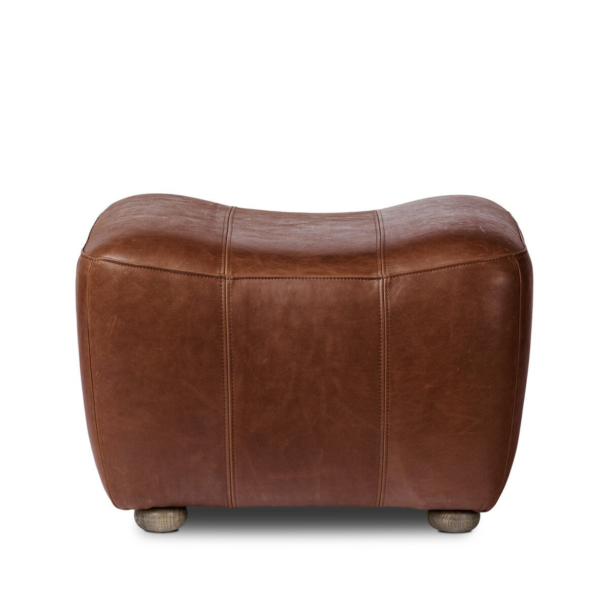 Four Hands Kylo Ottoman in Dulane Mahogany on a white background at Addison West