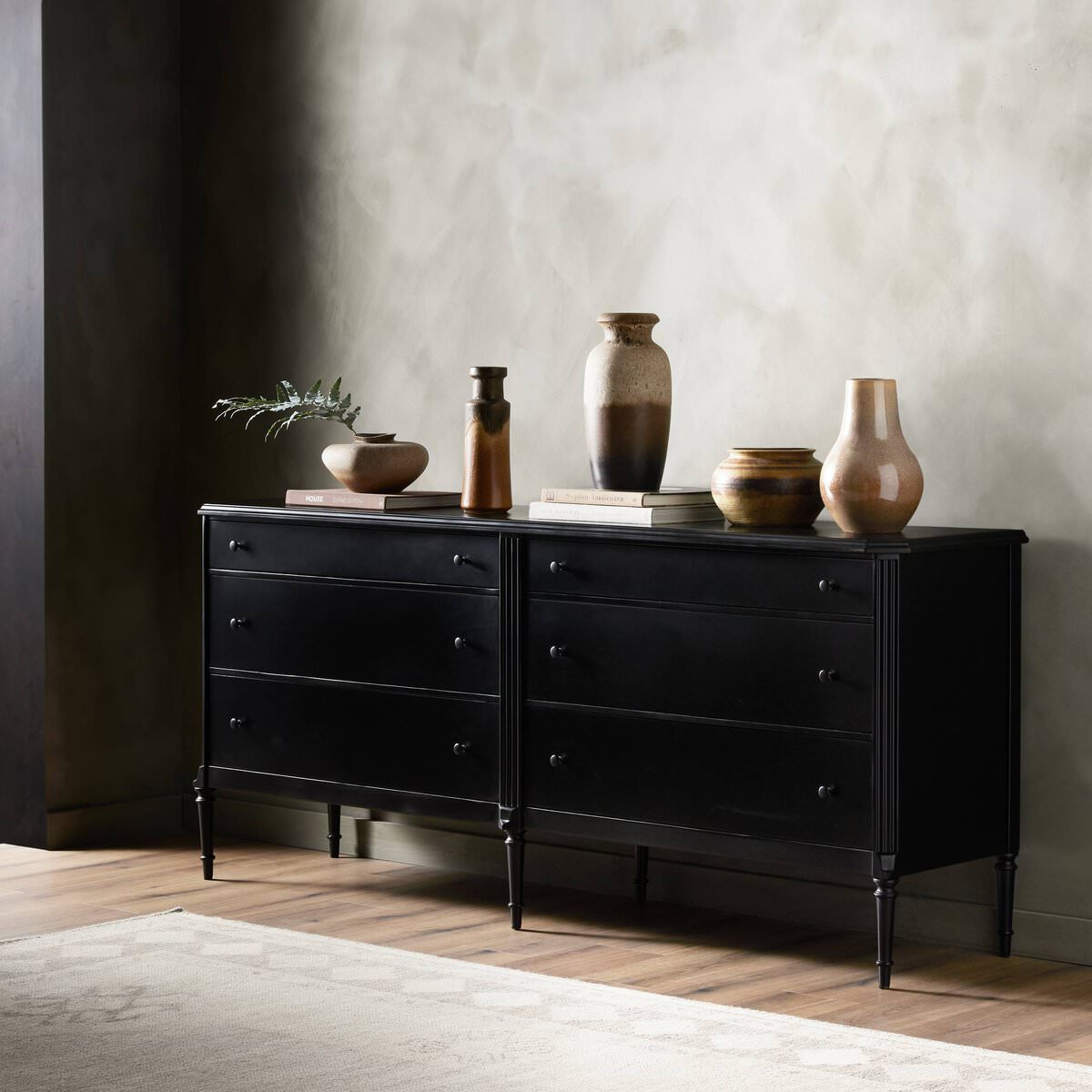 Four Hands Lendon 6 Drawer Dresser in Black in a modern room with dark walls