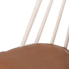 Close up of Four Hands Lewis Windsor Chair in Off White Whiskey Saddle on a white background