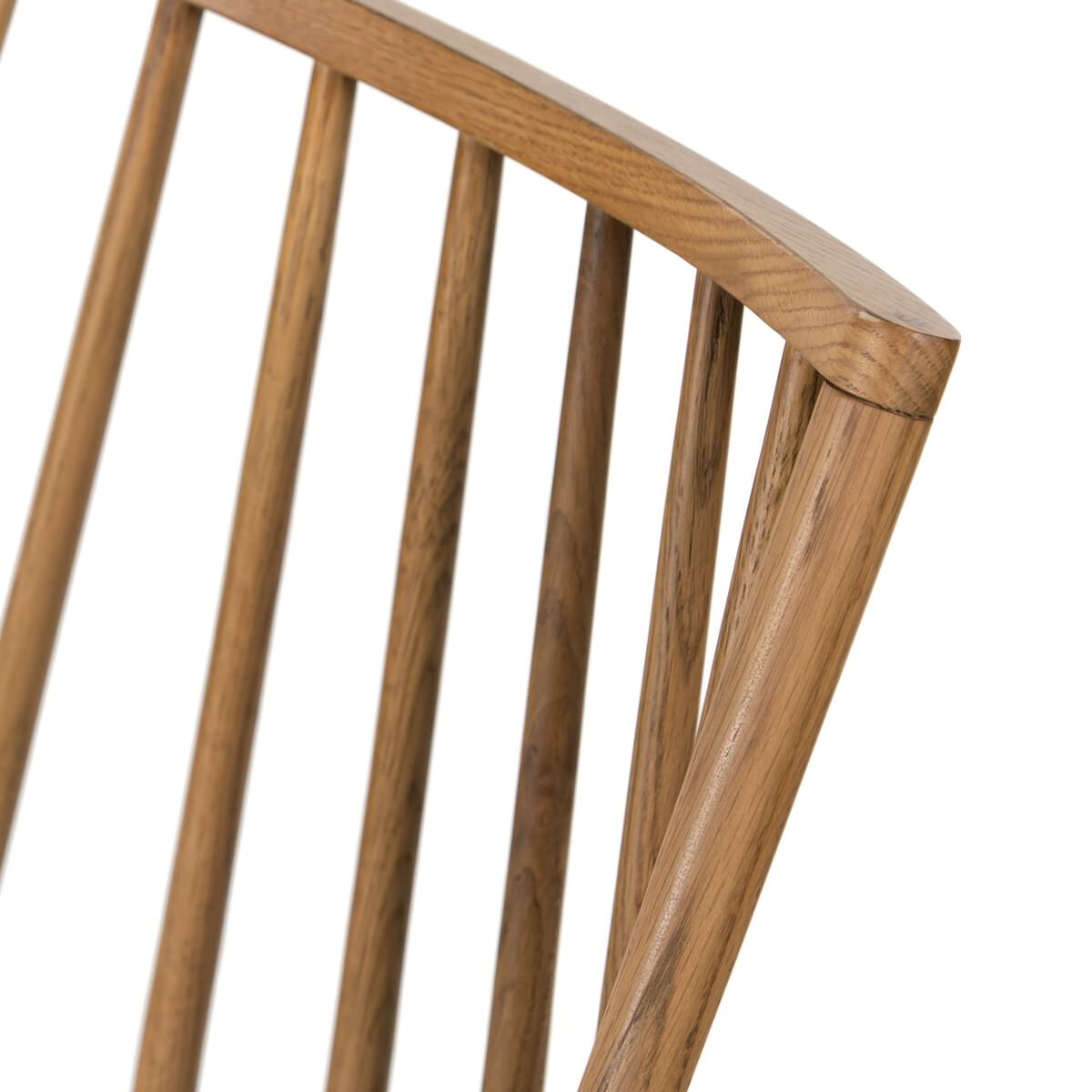 Close up of Four Hands Lewis Windsor Chair in Sandy Oak Shorn Sheepskin on a white background