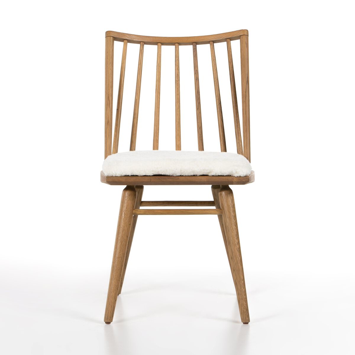 Four Hands Lewis Windsor Chair in Sandy Oak Shorn Sheepskin on a white background