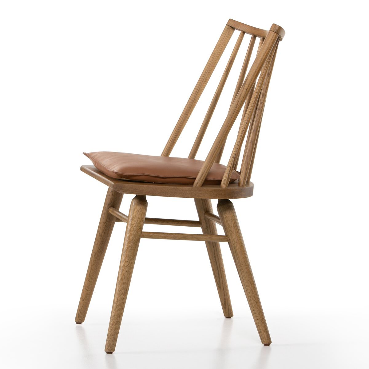 Four Hands Lewis Windsor Chair in Sandy Oak Whiskey Saddle on a white background