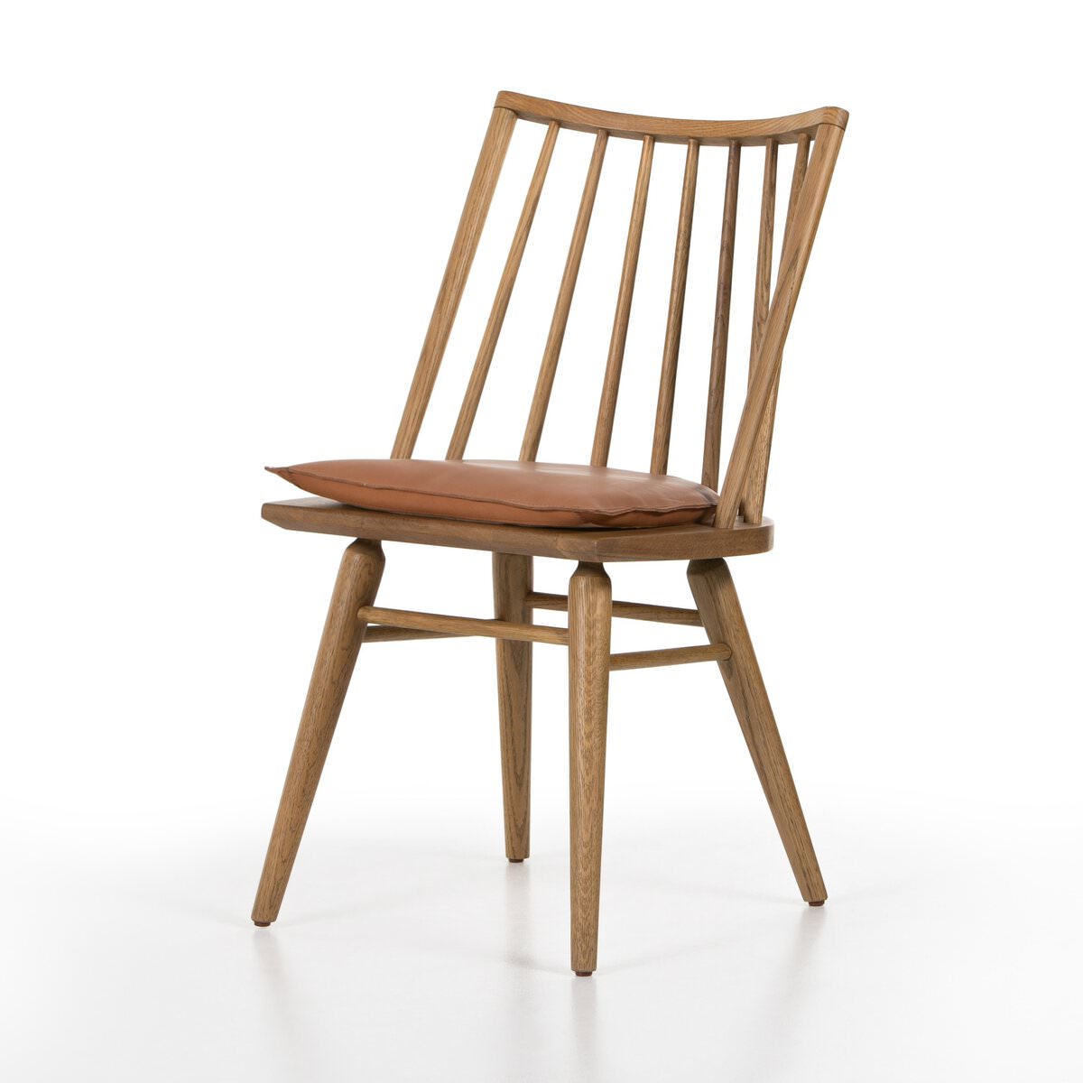 Four Hands Lewis Windsor Chair in Sandy Oak Whiskey Saddle on a white background