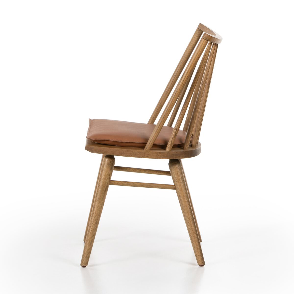Four Hands Lewis Windsor Chair in Sandy Oak Whiskey Saddle on a white background