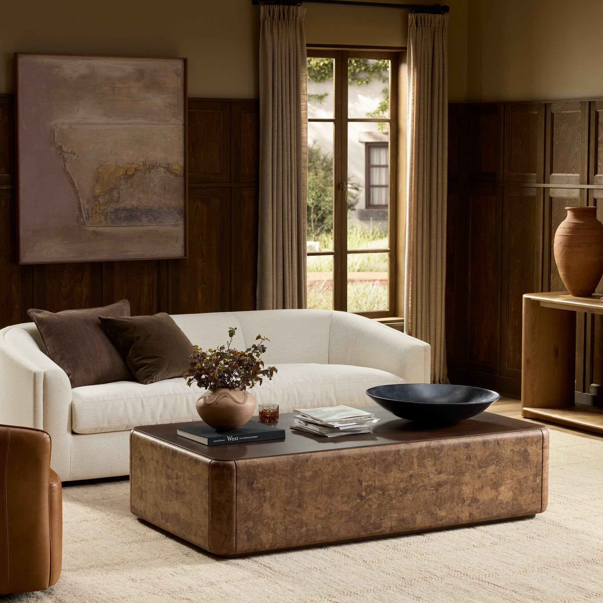 Four Hands Lola Coffee Table in Umber Oak Veneer in a living room at Addison West