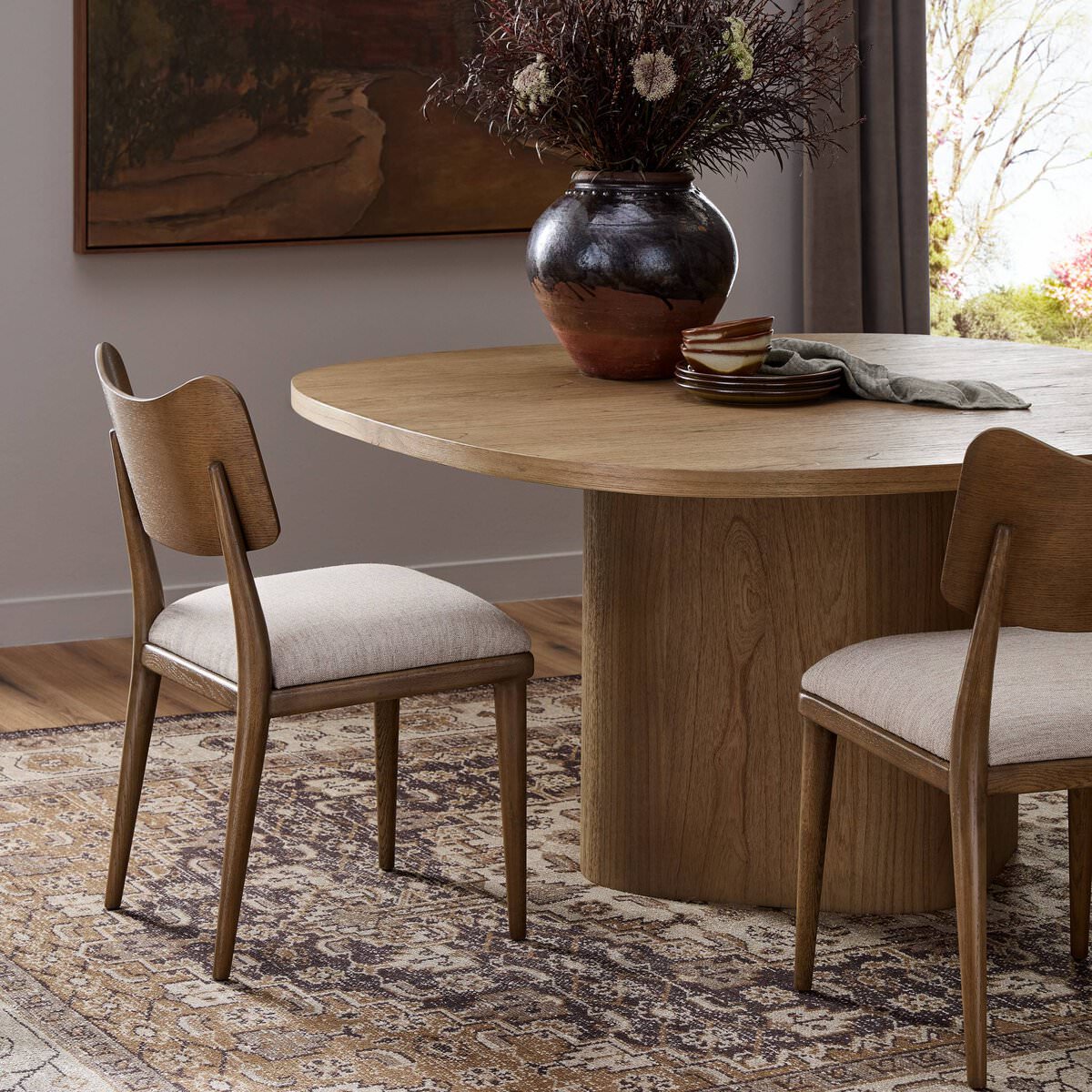 Four Hands Marley Dining Chair in Alcala Wheat in a dining room at Addison West