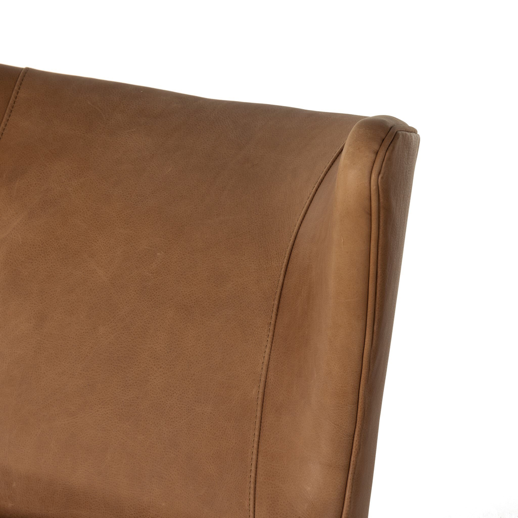 Close up of the Four Hands Marlow Wing Chair in Palermo Cognac on white background at Addison West.