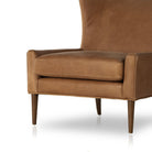 Close up of the Four Hands Marlow Wing Chair in Palermo Cognac on white background at Addison West.