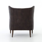Four Hands Marlow Wing Chair in Vintage Black on white background at Addison West.