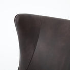 Close up of the Four Hands Marlow Wing Chair in Vintage Black on white background at Addison West.