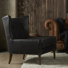 Four Hands Marlow Wing Chair in Vintage Black in living room at Addison West.