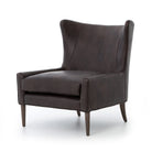 Four Hands Marlow Wing Chair in Vintage Black on white background at Addison West.