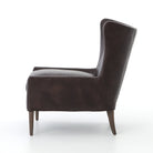 Four Hands Marlow Wing Chair in Vintage Black on white background at Addison West.
