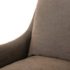 Close up of Four Hands Monette Glider Swivel in Broadway Coffee on a white background at Addison West
