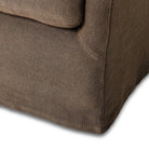 Close up of Four Hands Monette Glider Swivel in Broadway Coffee on a white background at Addison West