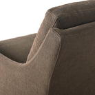 Close up of Four Hands Monette Glider Swivel in Broadway Coffee on a white background at Addison West