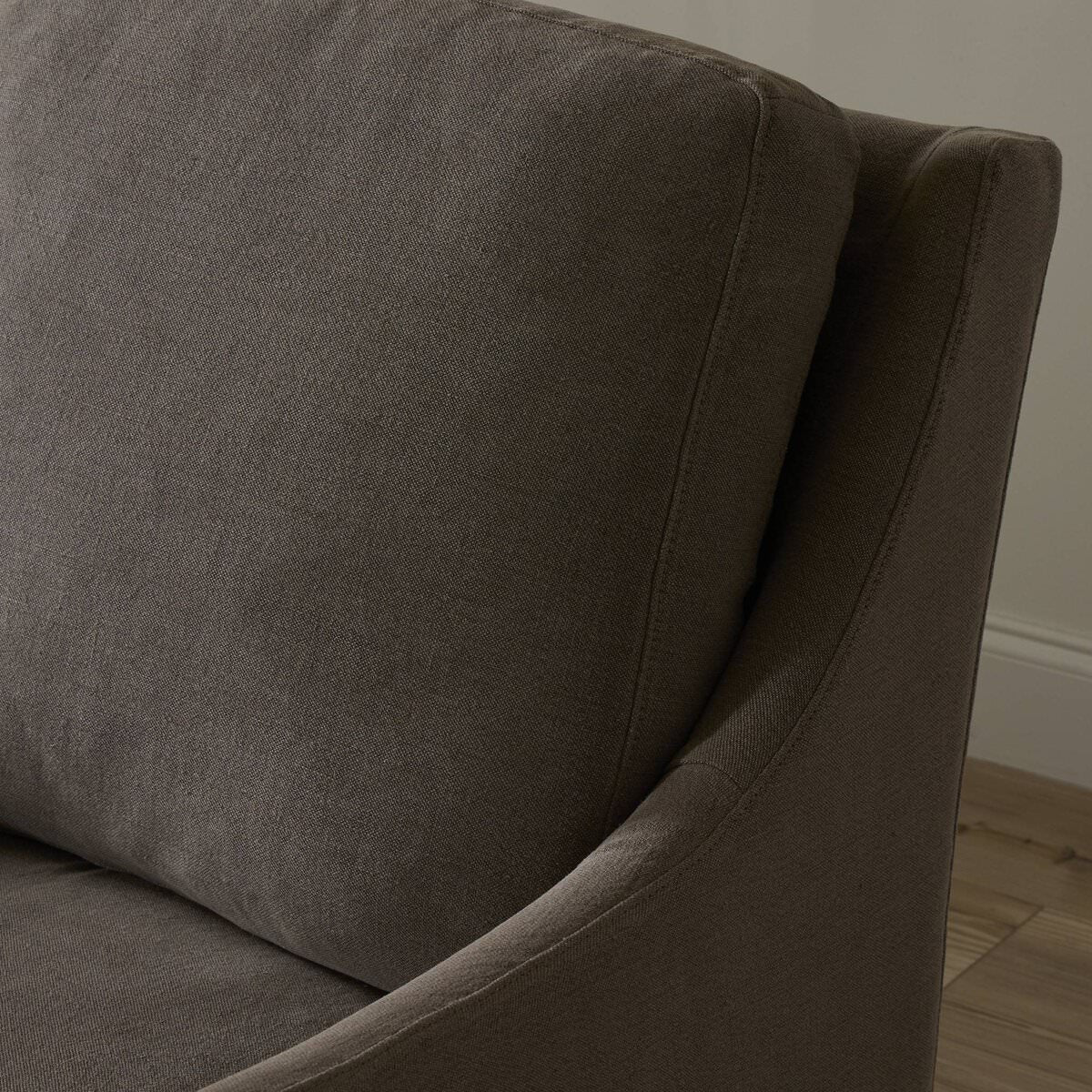 Close up of Four Hands Monette Glider Swivel in Broadway Coffee in a living room at Addison West