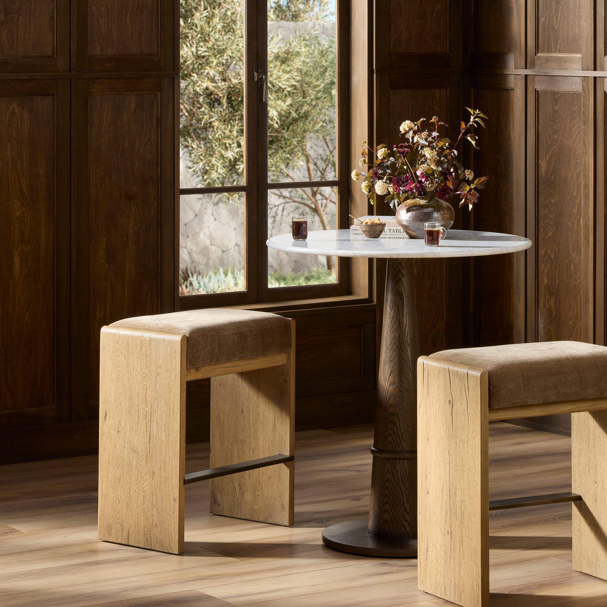 Four Hands Nash Counter Stool in Altair Mushroom in a dining room at Addison West.