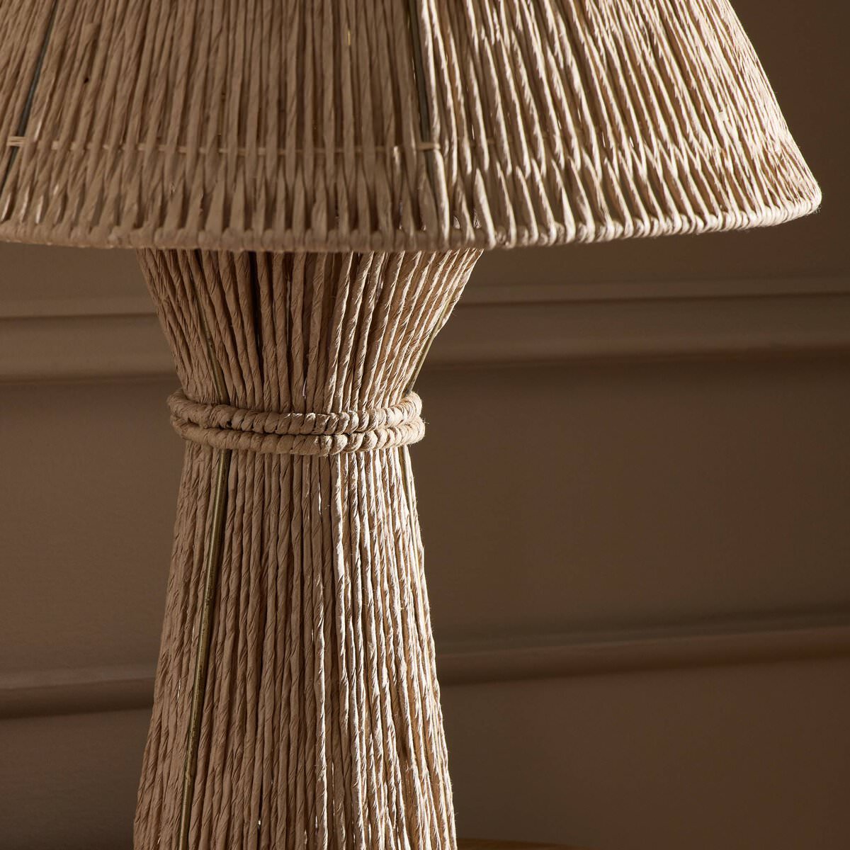 Close up of Four Hands Nessa Table Lamp in Antique Brass Iron on a table at Addison West